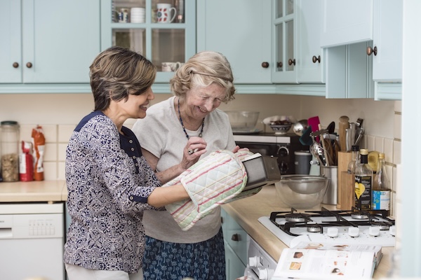 A Hometouch live-in carer supporting an older adult at home