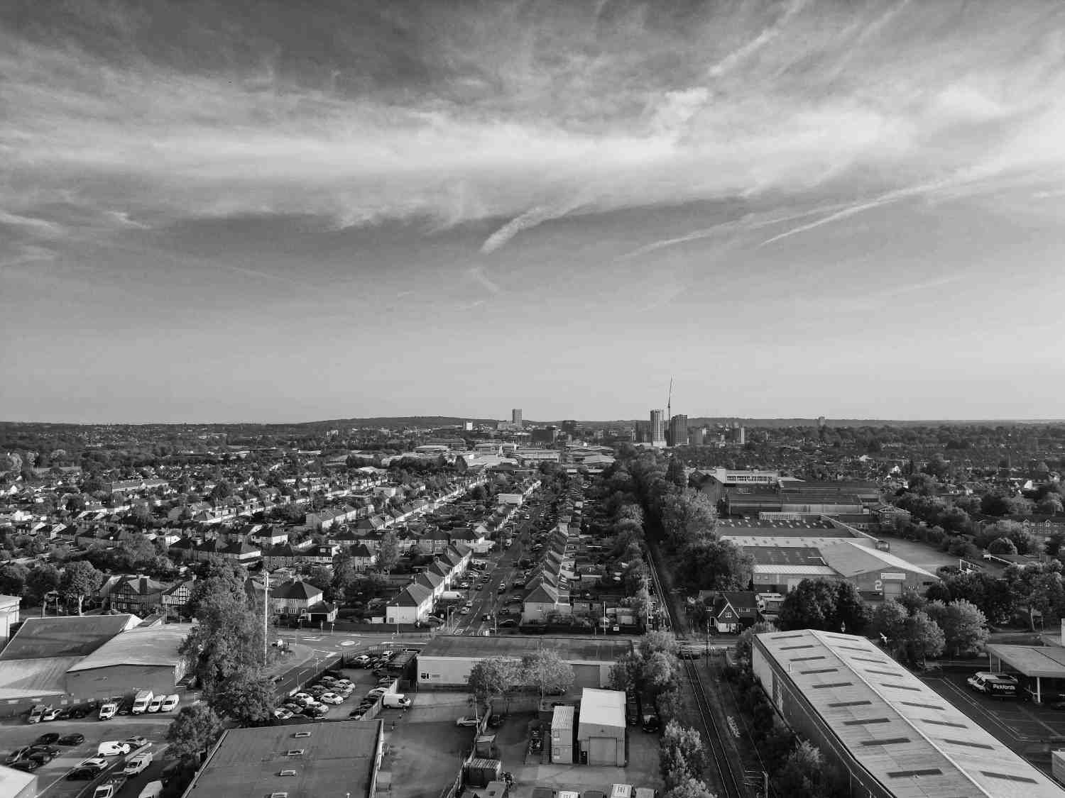 Overhead perspective of Watford, highlighting its architecture, canals, and green spaces.